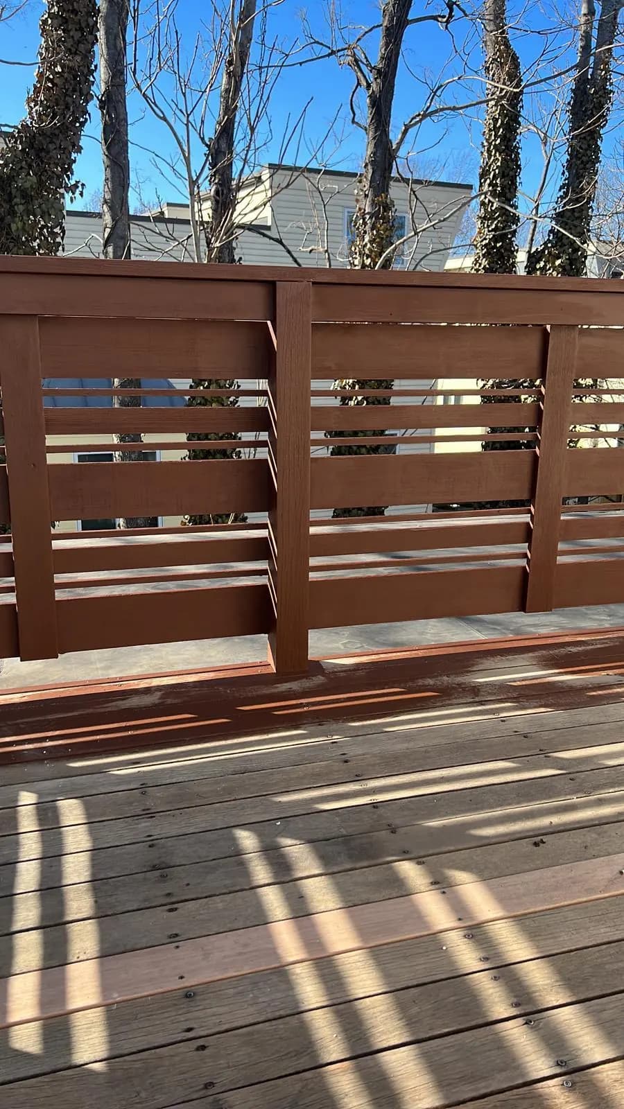 Freshly stained deck railing, finished by Colorstar