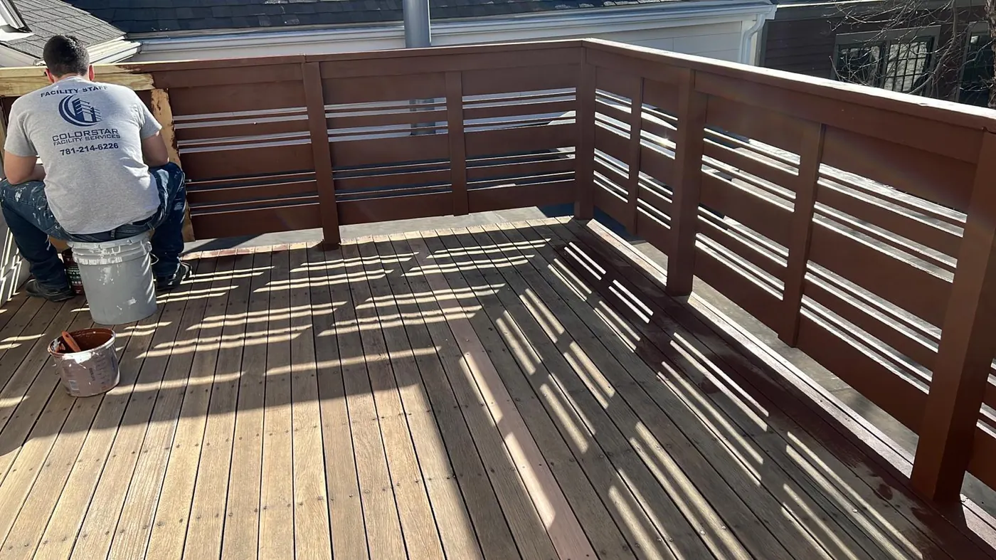 The Colorstar crew sanding and staining a deck on the North Shore