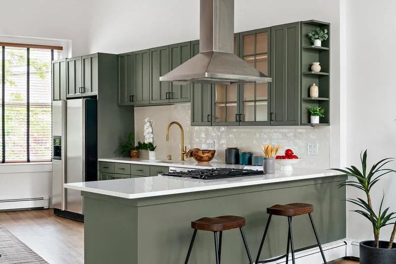 Kitchen remodel by Colorstar with green cabinetry, modern finishes, and clean layout